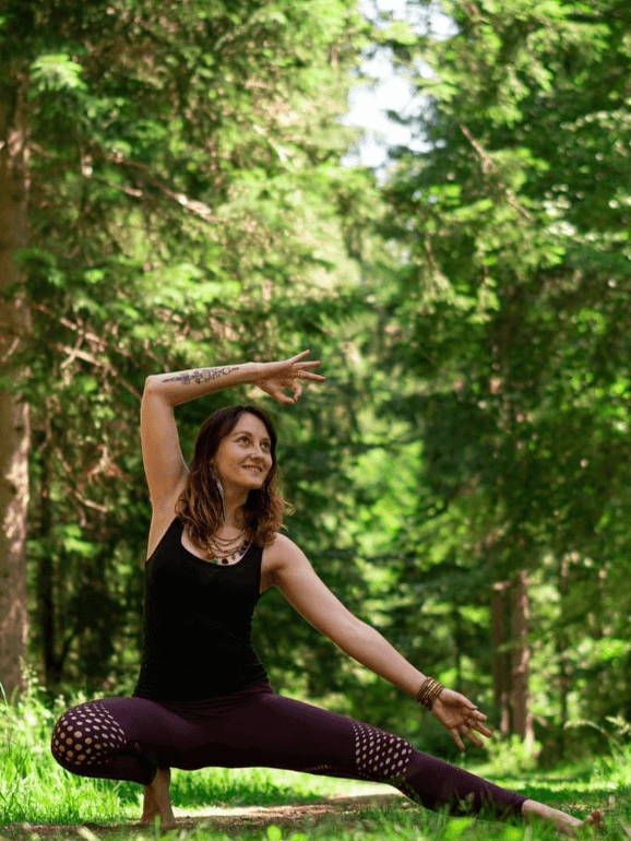 Yoga teacher practising in a forest near Ilmenau, Thuringia